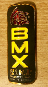 Mongoose - BMX Products Inc Moorpark USA - Black, Gold highlight Red and Yellow Infill.
